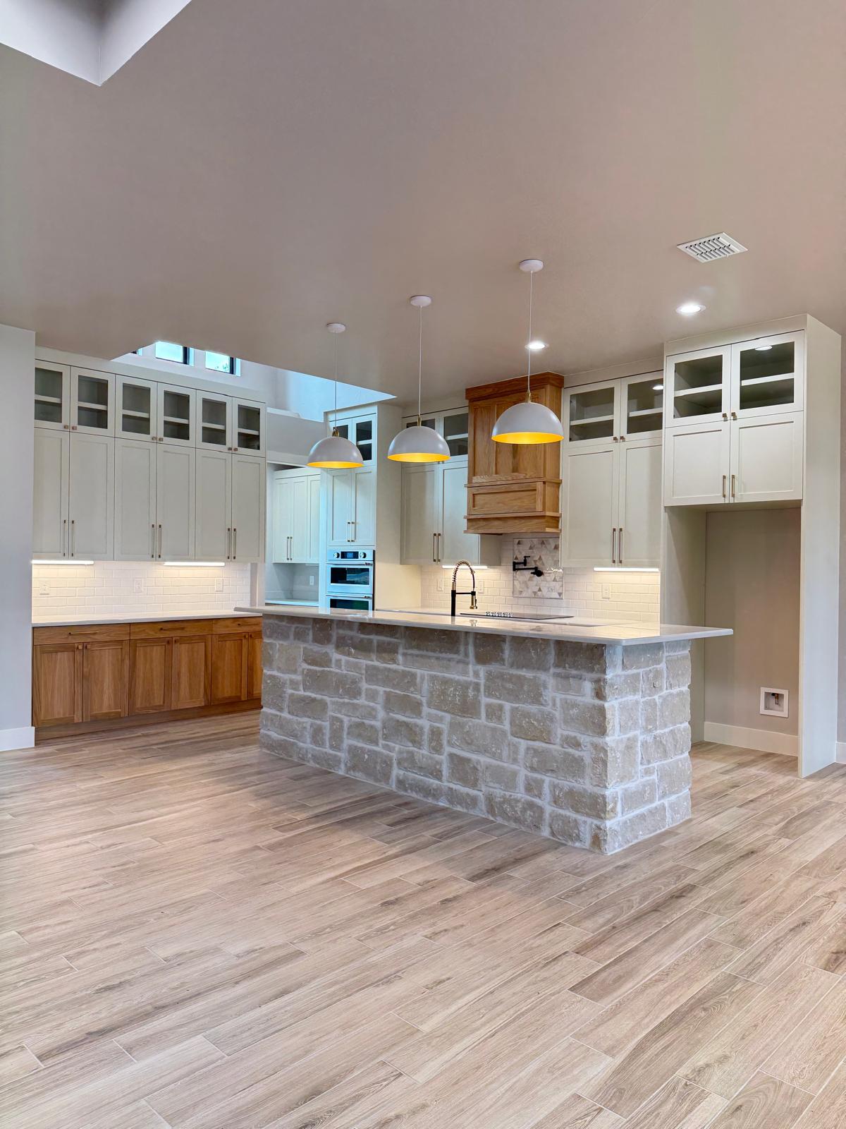 Open-concept kitchen with custom island cabinetry in San Antonio