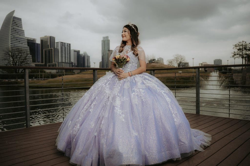 Quinceañera in lavender gown with Austin skyline behind