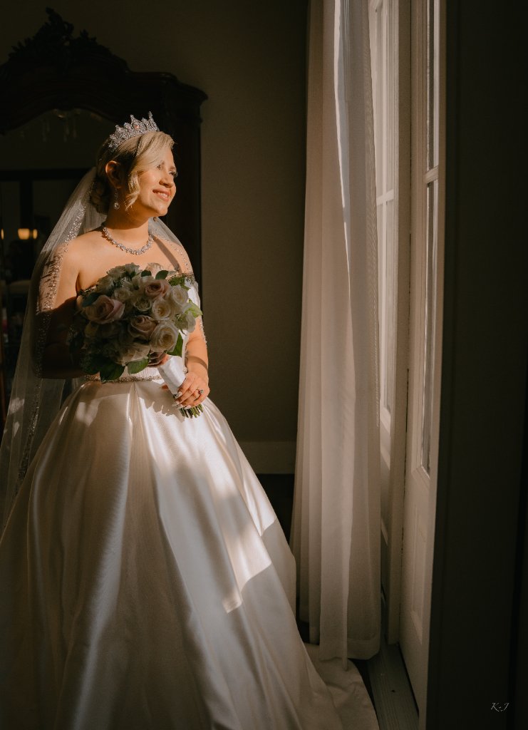 Bride in profile with veil and bouquet