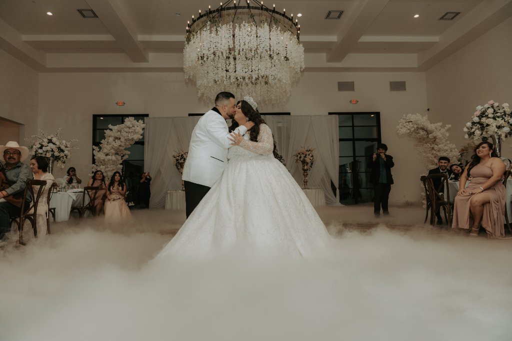 Couple kissing on fog-filled dance floor
