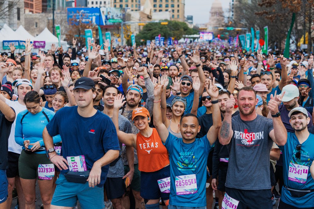 Massive crowd of runners filling Congress Avenue