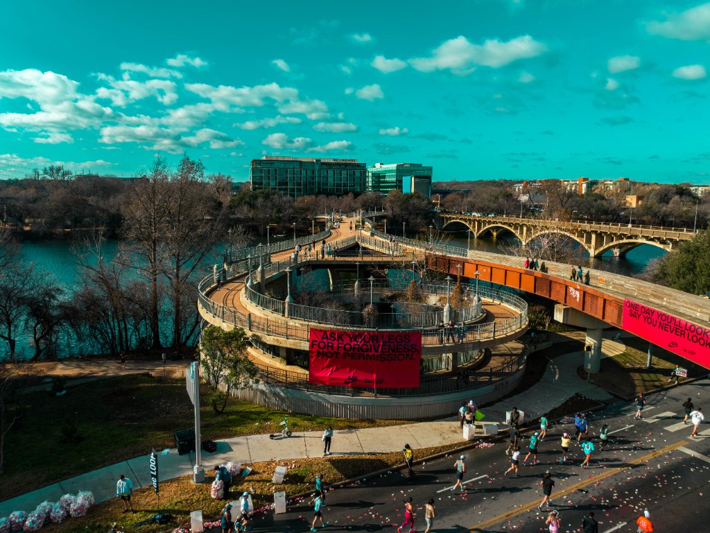 Aerial view of Austin Marathon course with motivational banners and runners