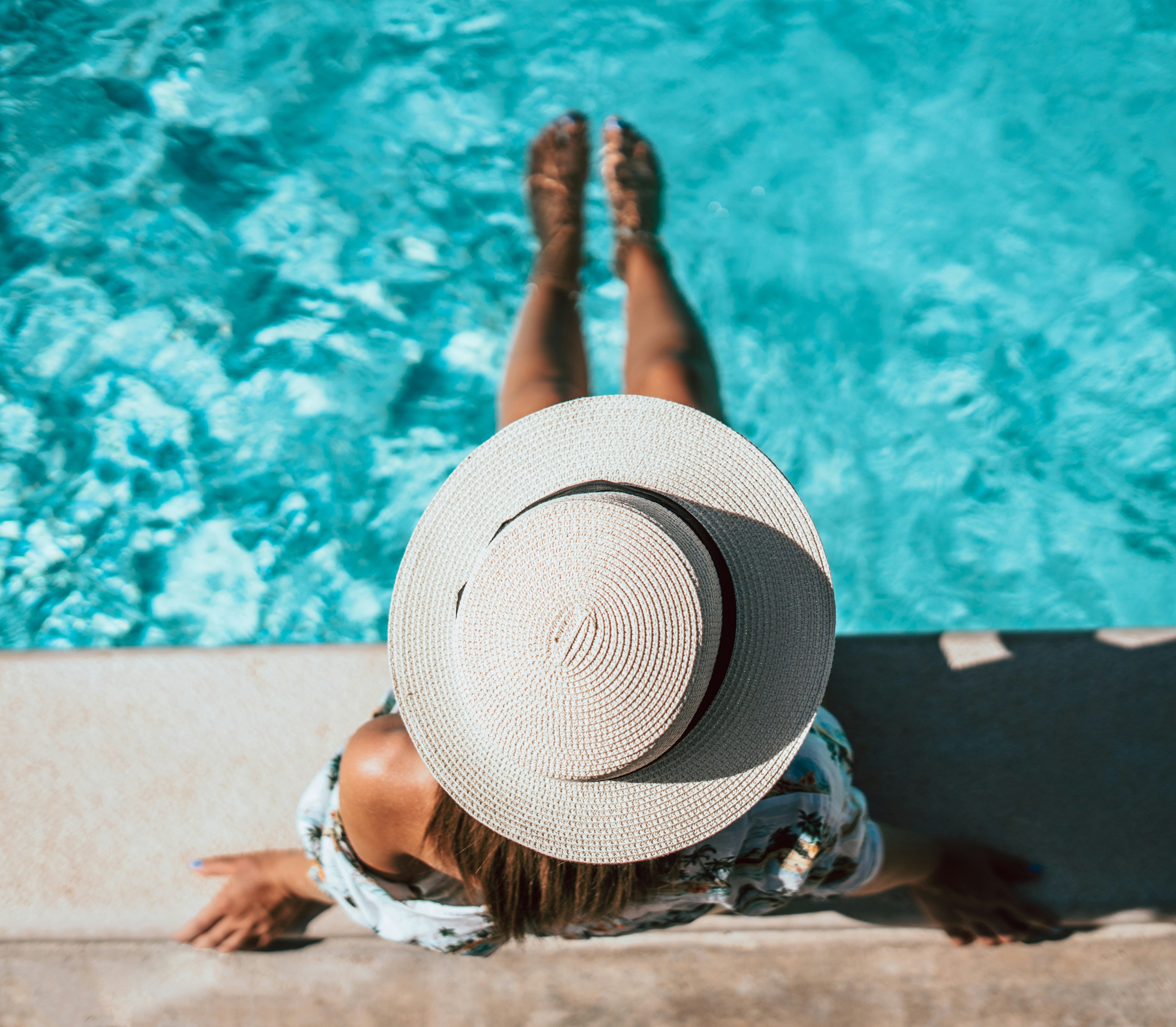 Pool deck with loungers and umbrellas