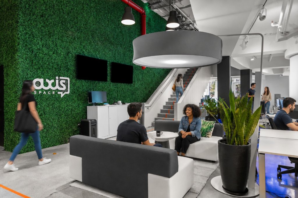 Axis Space lobby and reception, green feature wall, modular seating, open and welcoming