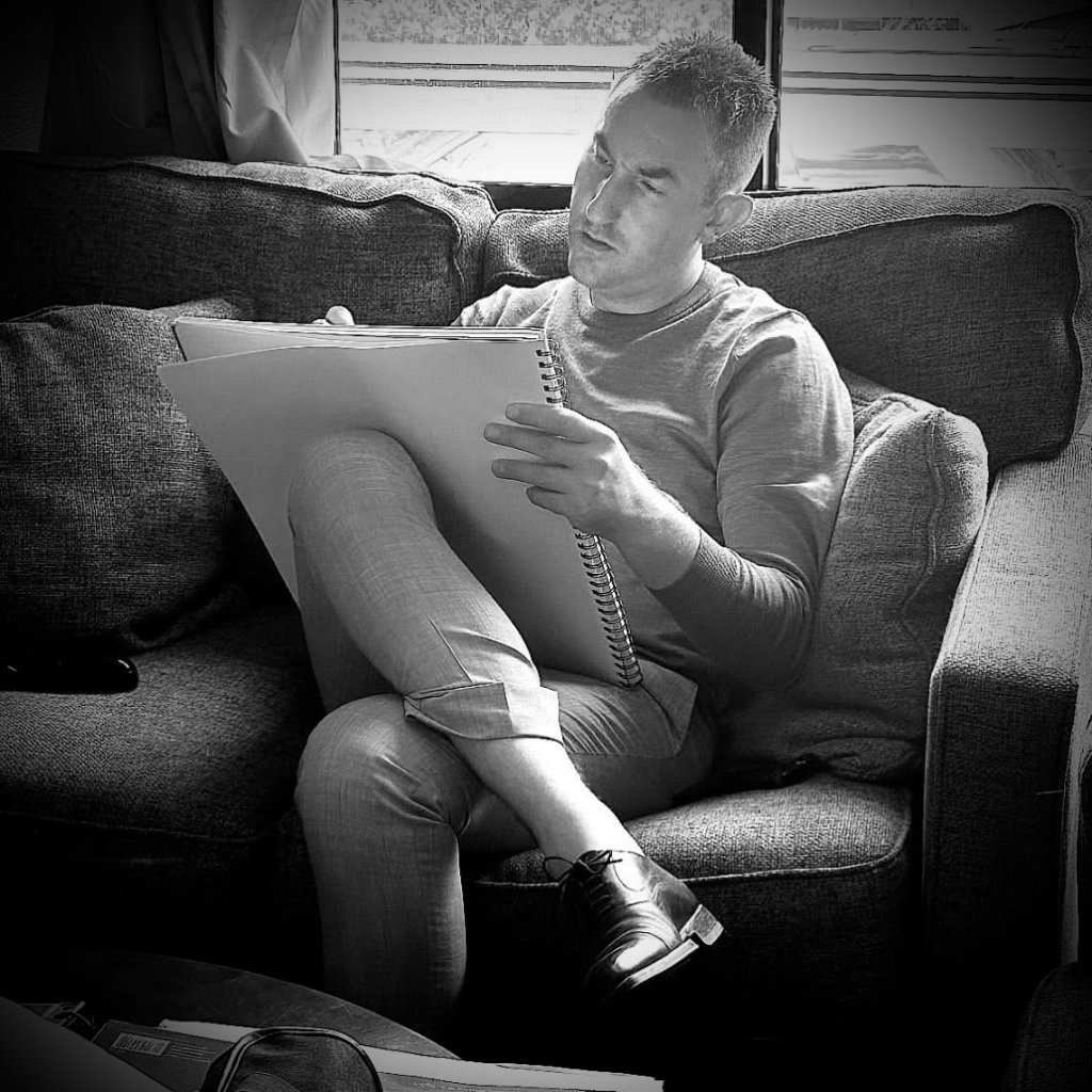 Jared Nanke sketching in a notebook, July 2024