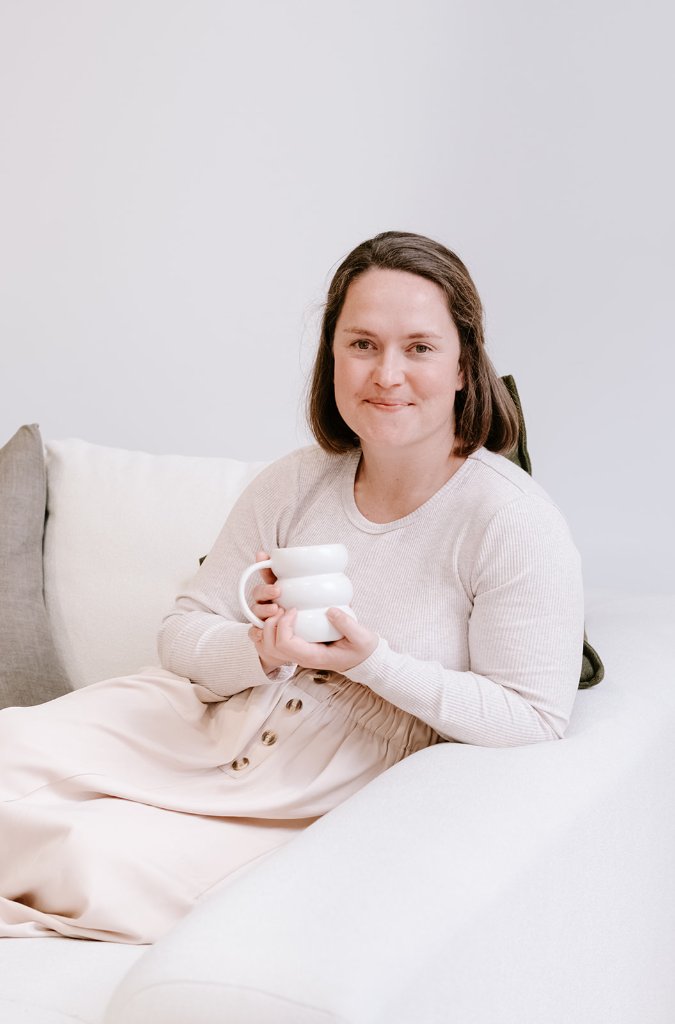 Shelly — founder of Rise, in a thoughtful pose with natural light