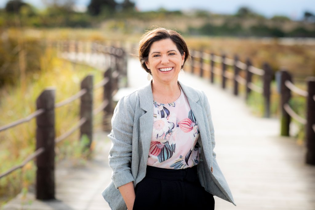 Beth from Onsite Insight, smiling outdoors