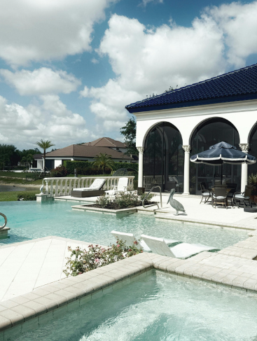 Mediterranean-style Florida wedding venue with a turquoise pool and white stone deck