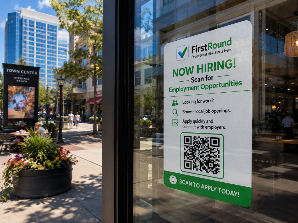 FirstRound NOW HIRING sign in a Town Center Virginia Beach café window