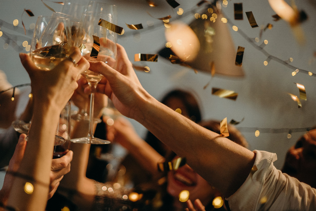 Adults celebrating at a private party with cocktails