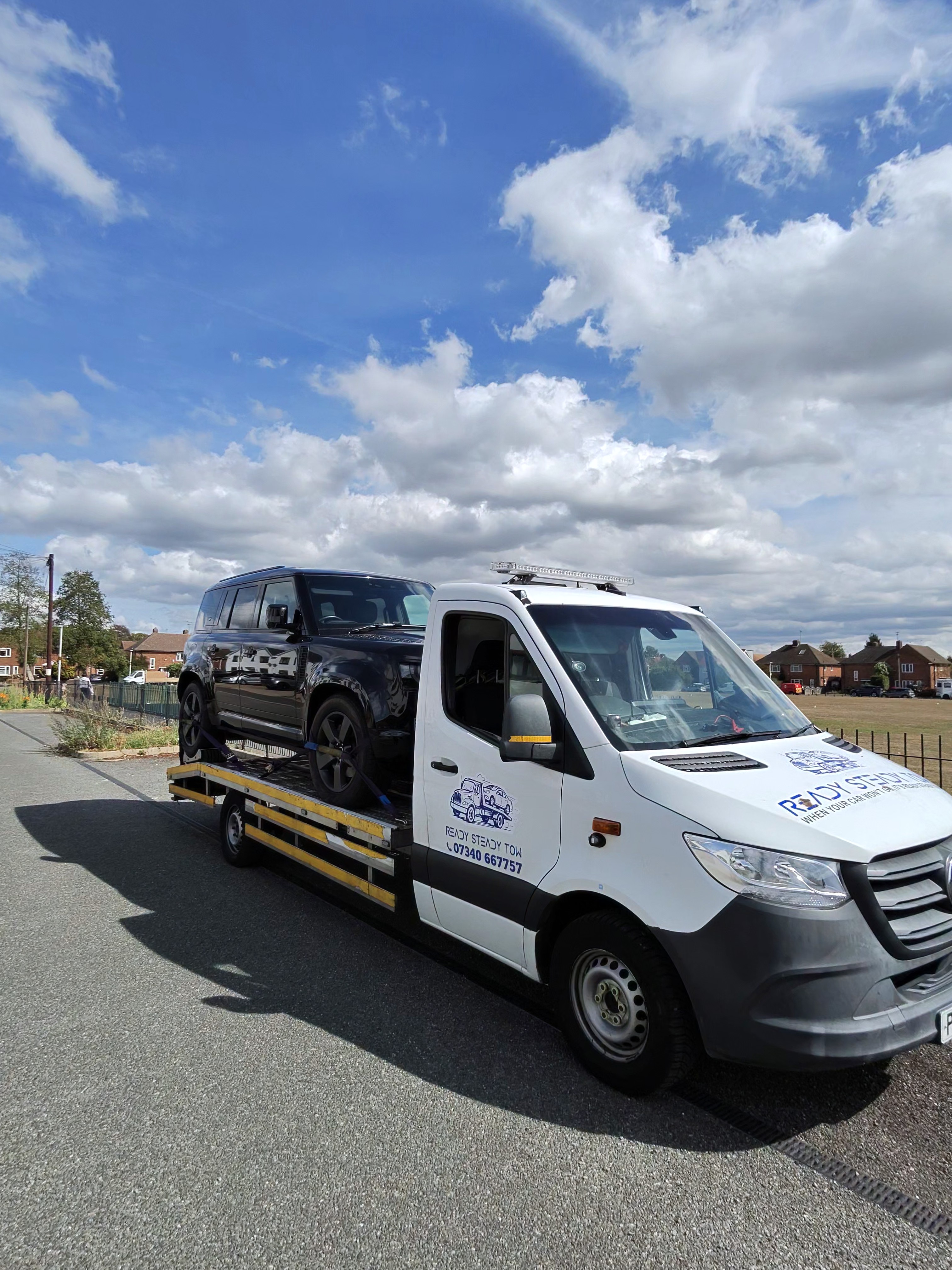 Ready Steady Tow recovery truck transporting a Land Rover Defender