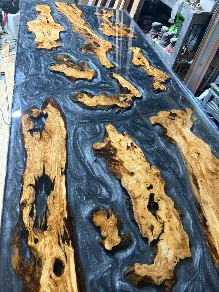 CNC machine precision-cutting a custom wood design