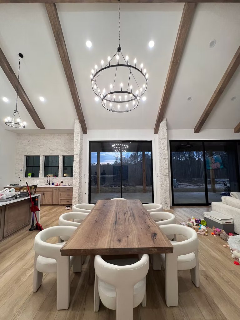 Custom walnut dining table in modern home by Novak Woodworks