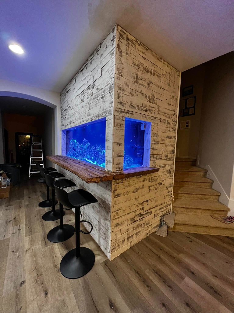 Custom wood bar top with aquarium feature wall by Novak Woodworks