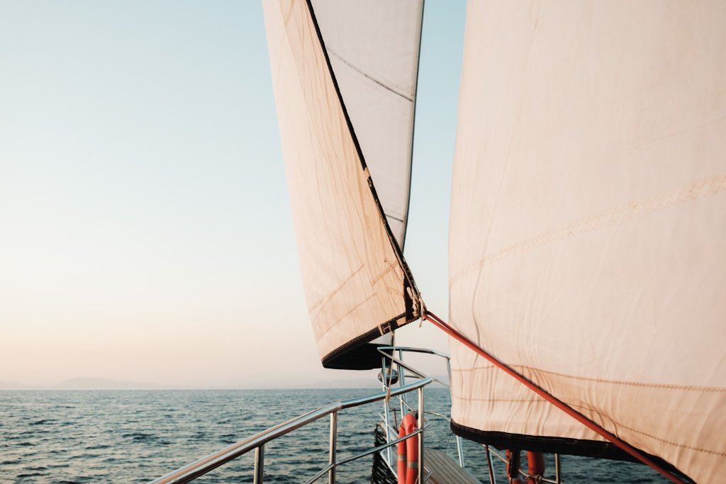 Wet sanding yacht hull refinishing by Sward Marine