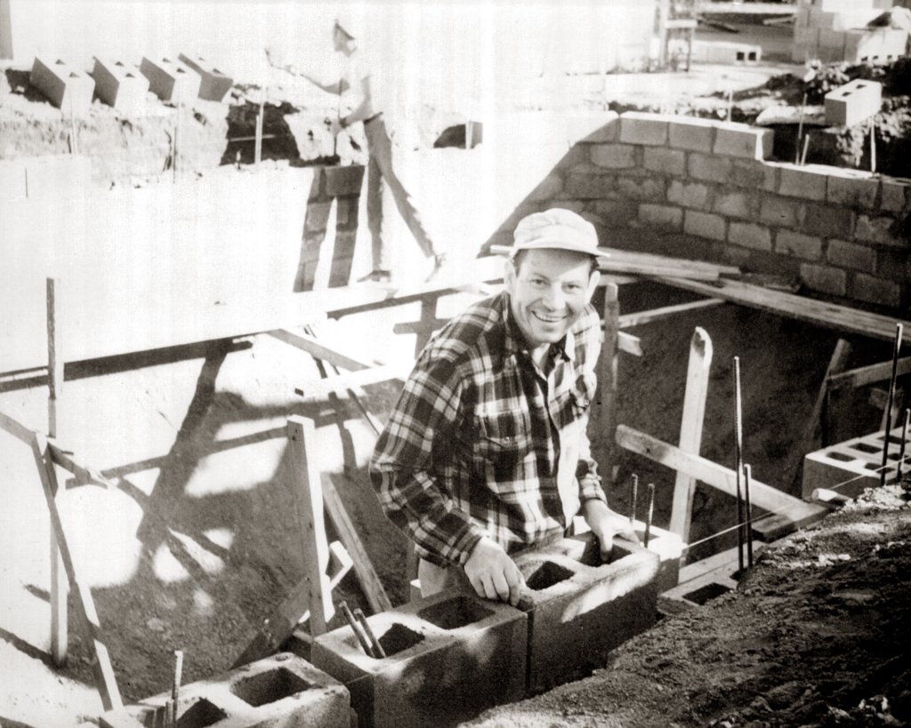 Wayne Steimle, founder of California Pools, laying concrete blocks