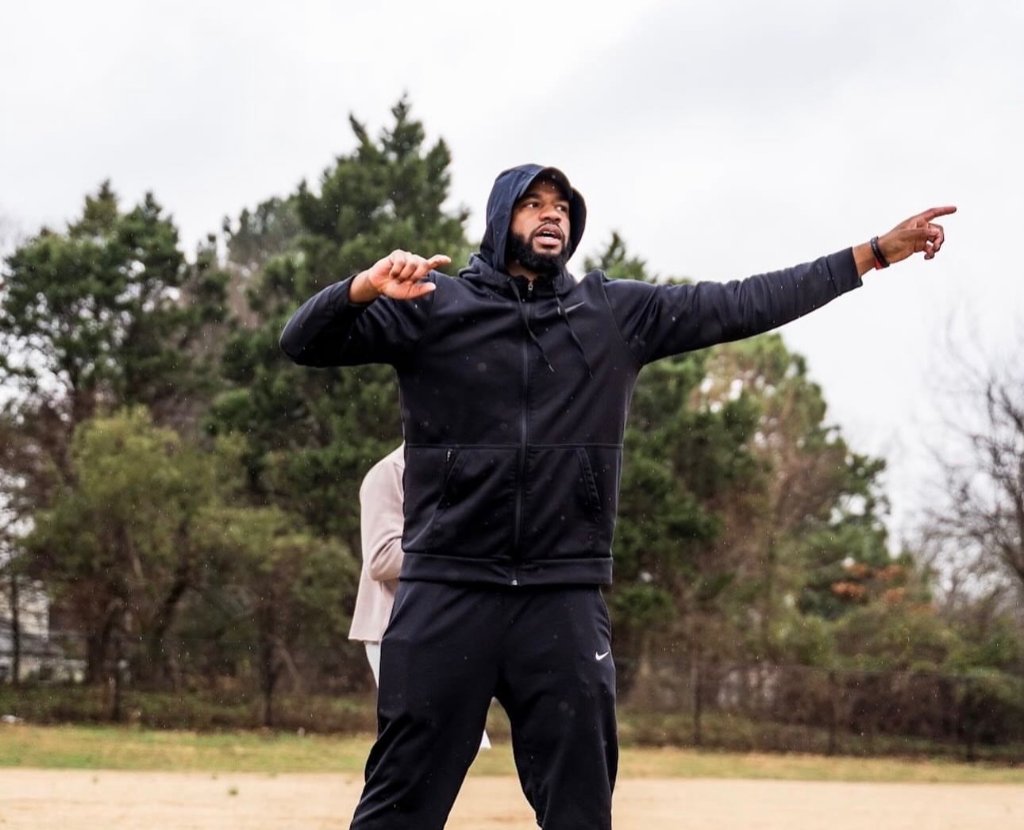 Coach Reggie Green coaching athletes