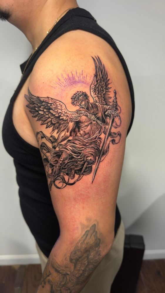 Archangel with sword — black & grey realism tattoo by Santiago