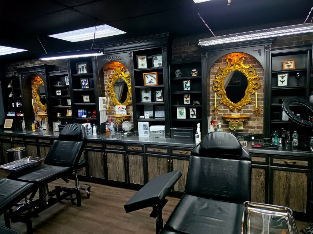 Tormented Souls studio interior with tattoo chairs and Victorian gothic cabinetry