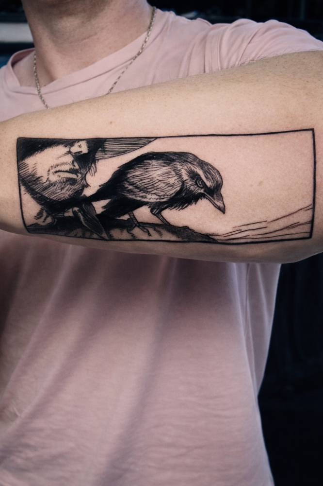 Framed crow with human face illustrative tattoo by Steve Gagliano