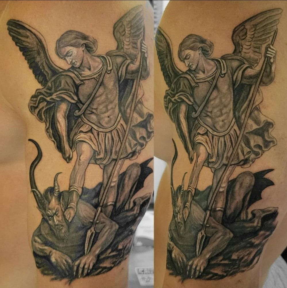 Archangel Michael standing over demon tattoo by Steve Gagliano