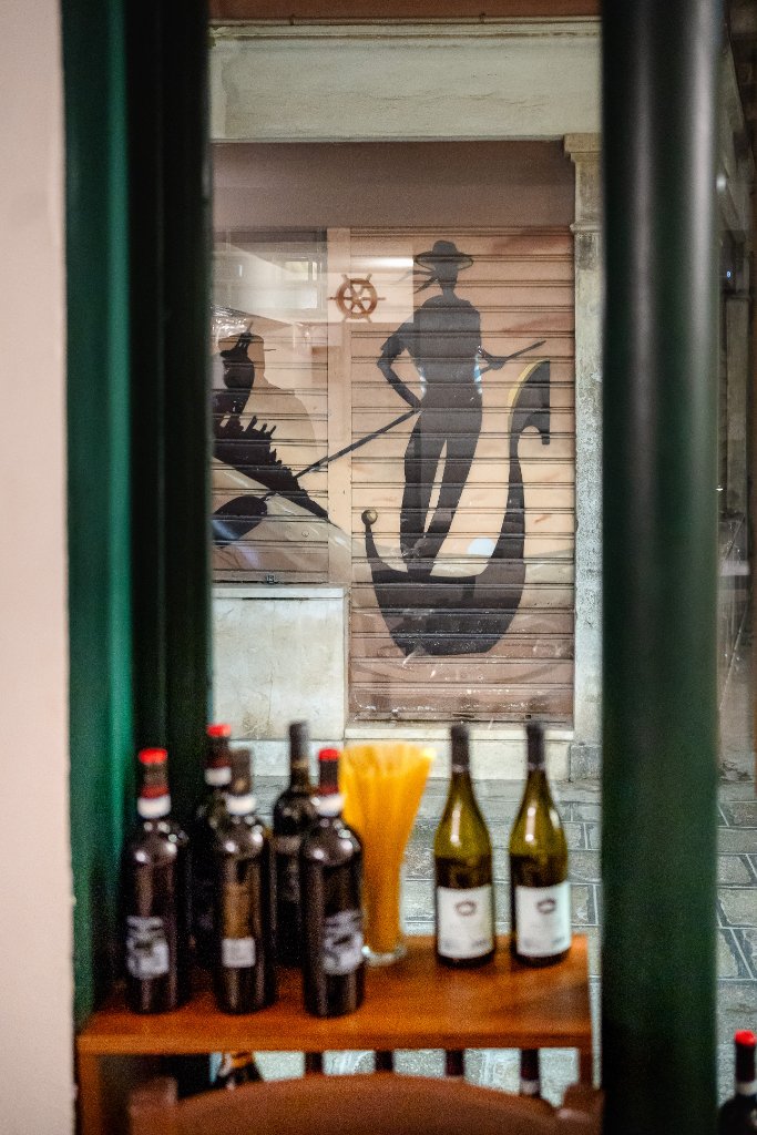 Wine bottles and pasta display by the entrance