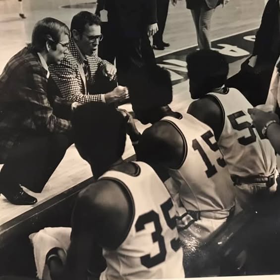 Team huddle during NCAA tournament game with Jack Sutter coaching