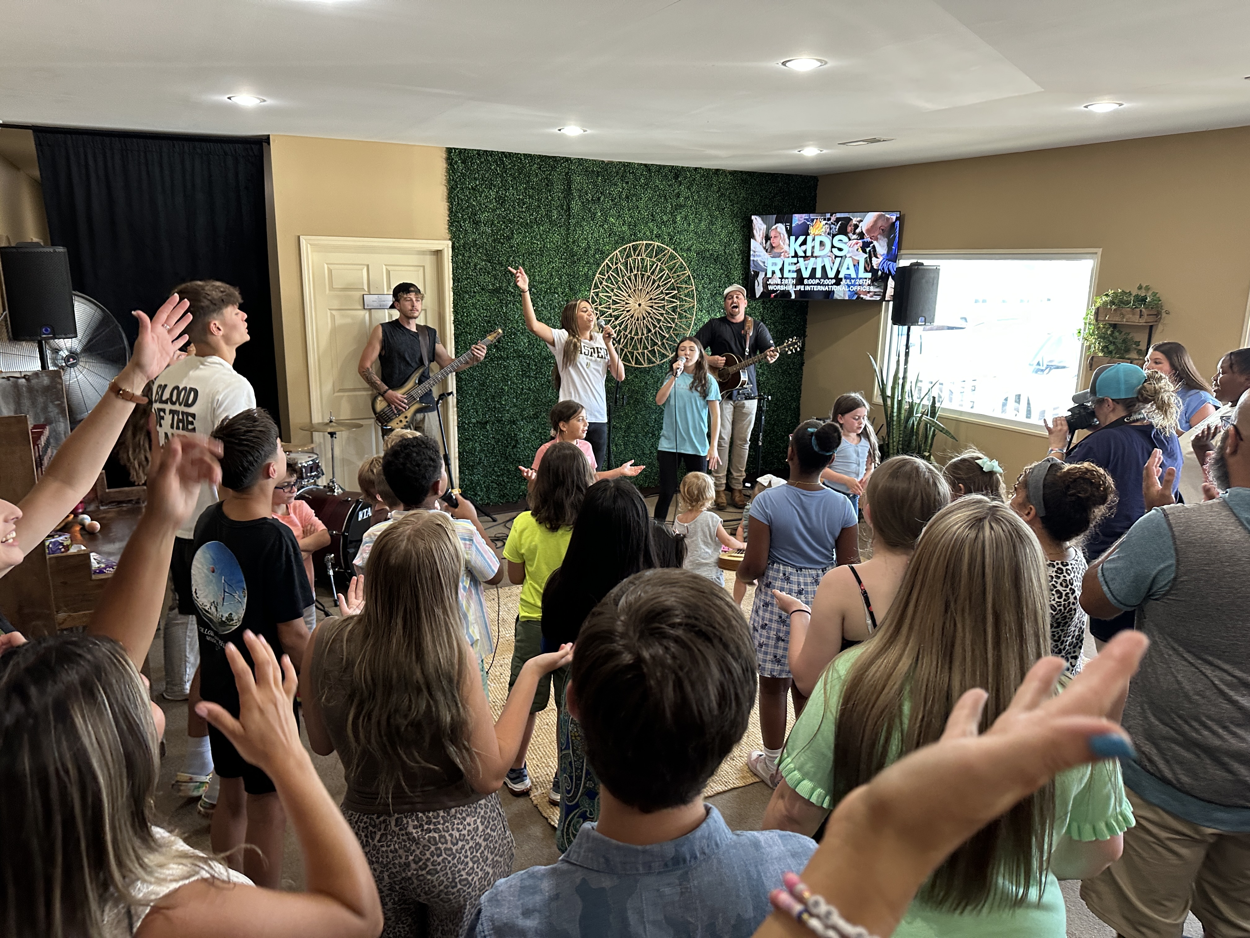 Youth revival, hands raised