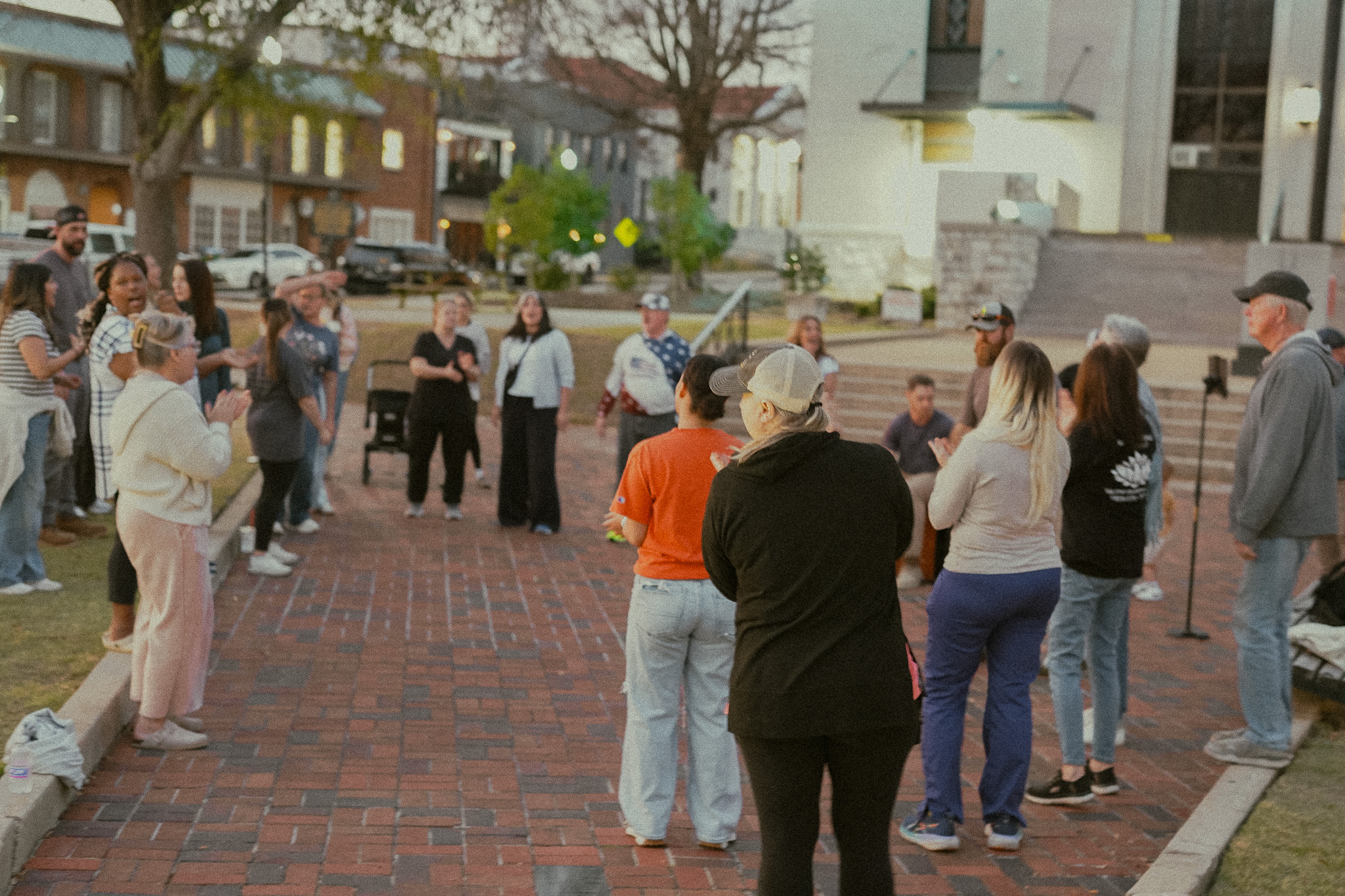 Community gathered on the brick plaza