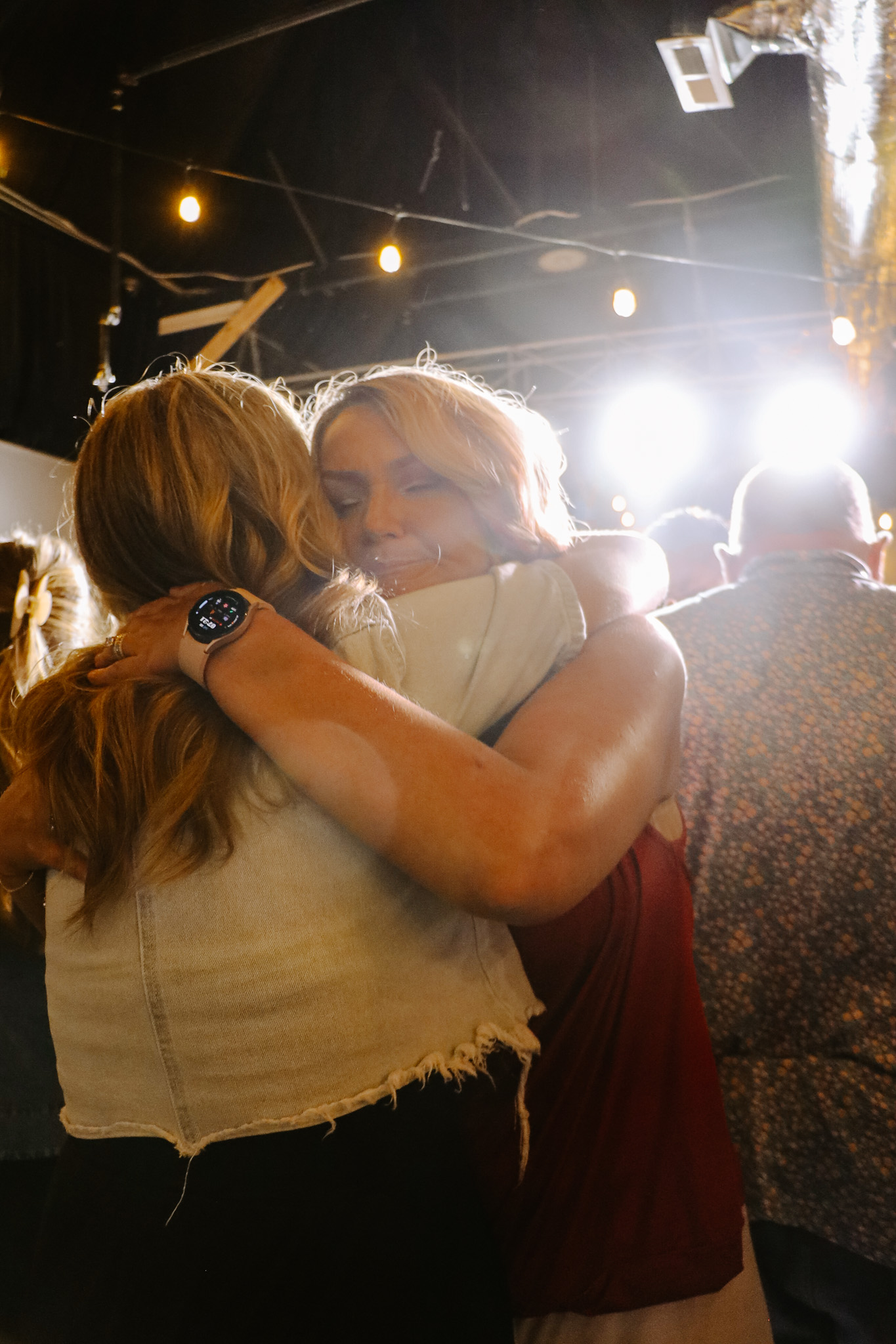 Two people embracing at a Storehouse gathering