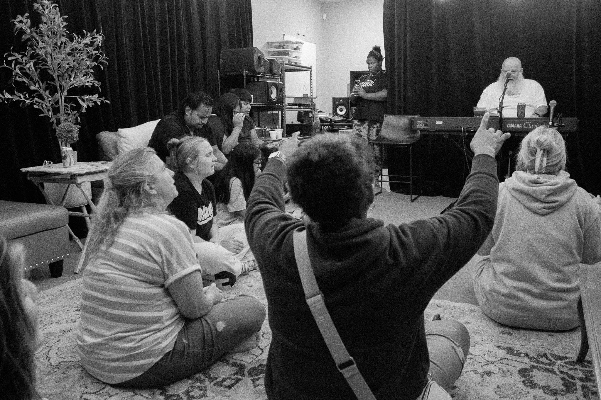 The room gathered in worship