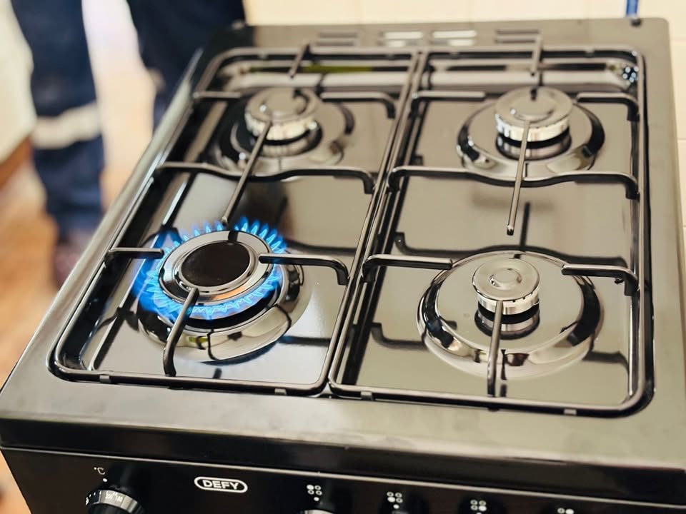 Defy gas stove installation with blue flame