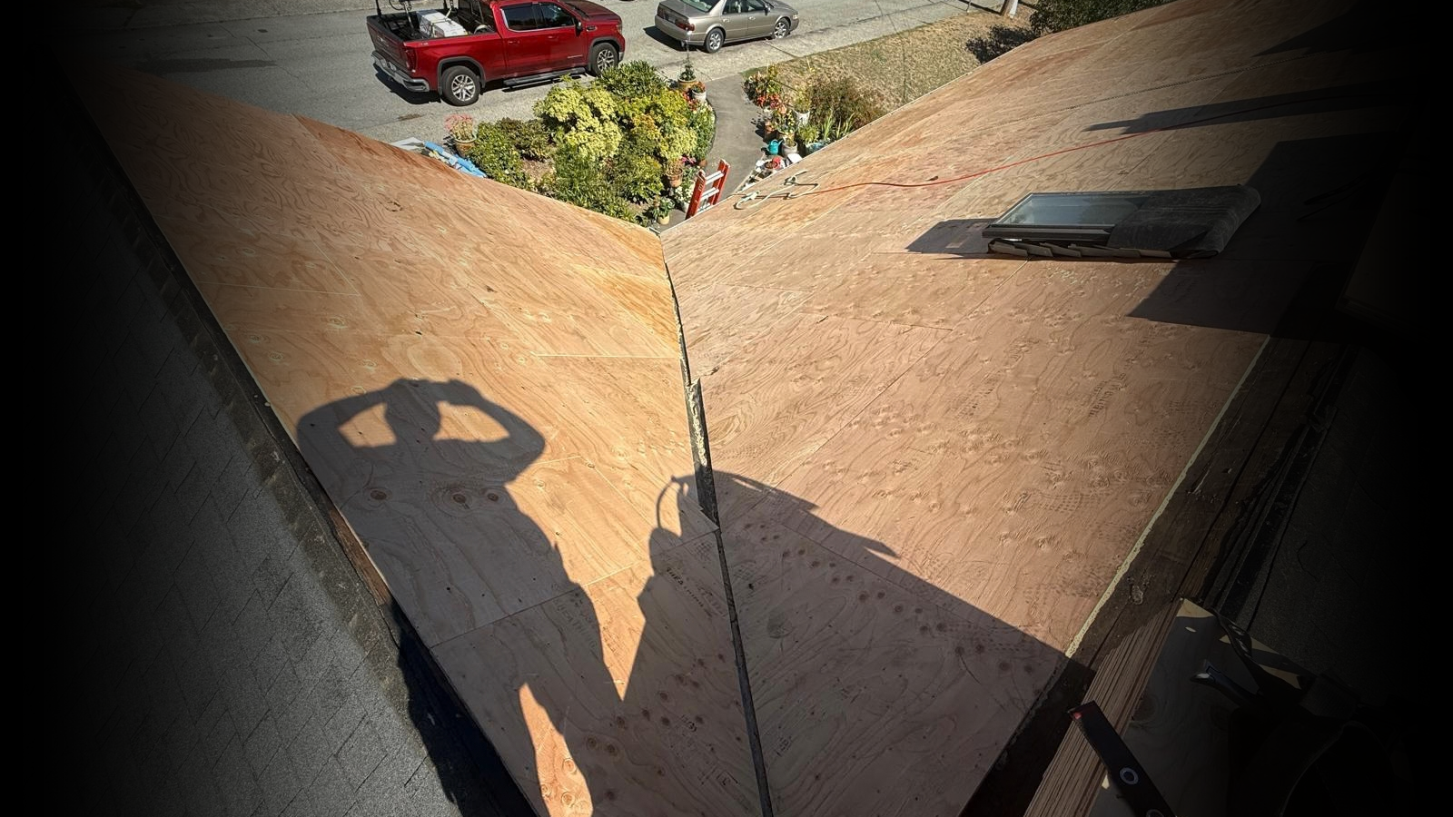 Newly sheathed roof valley and skylight during a Red Maple Roofing re-roof in the Tri-Cities