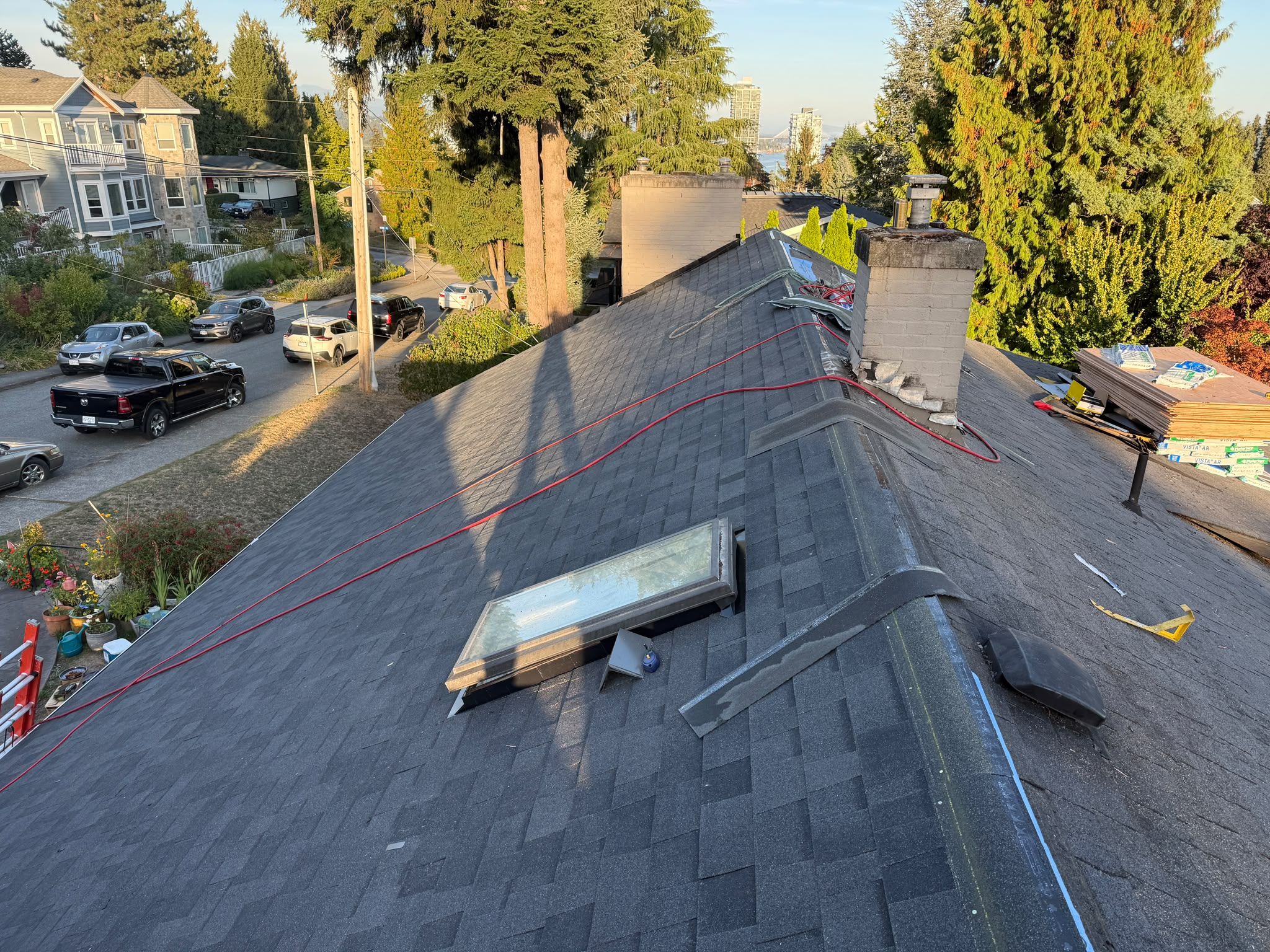 Gabled roof with asphalt shingles installed by Red Maple Roofing