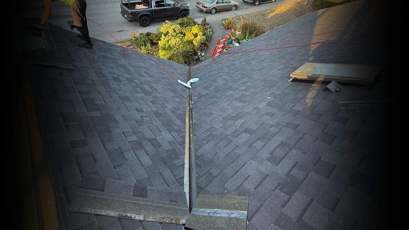 New architectural shingle roof with skylight after reroofing by Red Maple Roofing in Burnaby