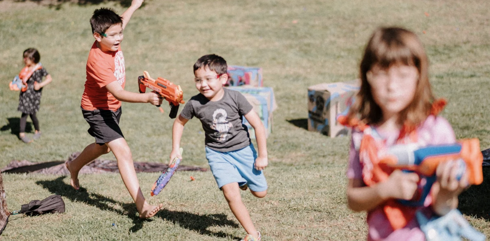 Kids enjoying an exciting Nerf battle party with professional coaches and premium equipment