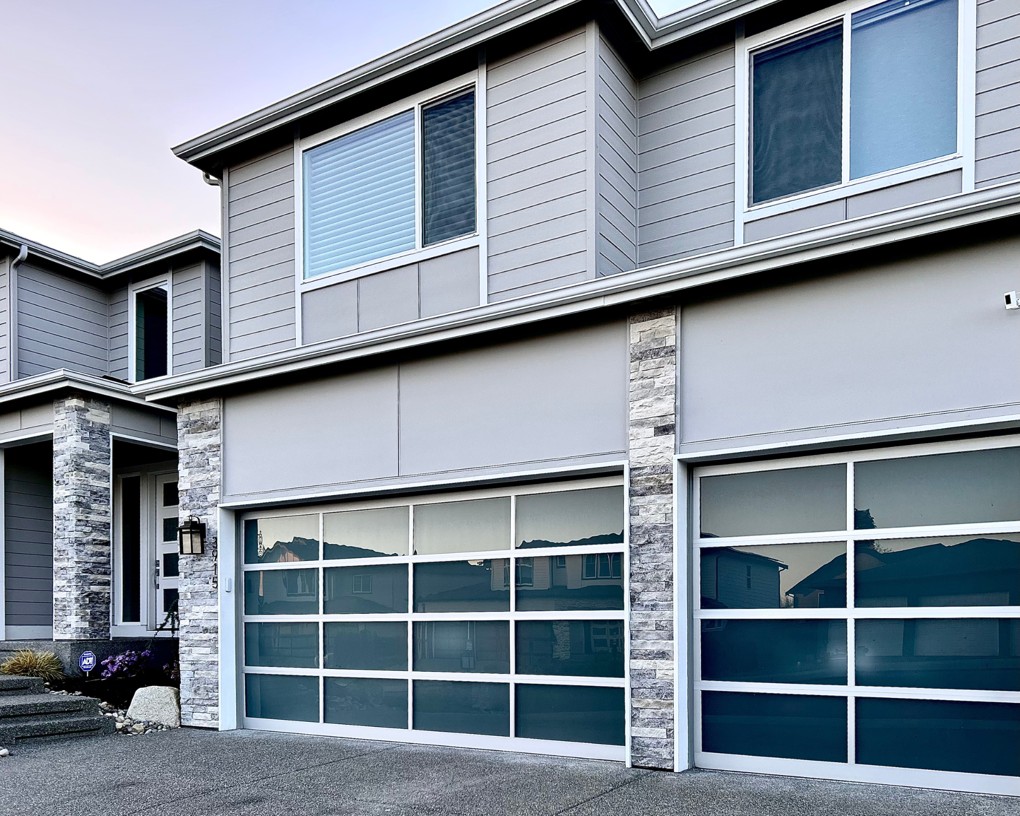 Modern Glass Garage & Stone Pillars