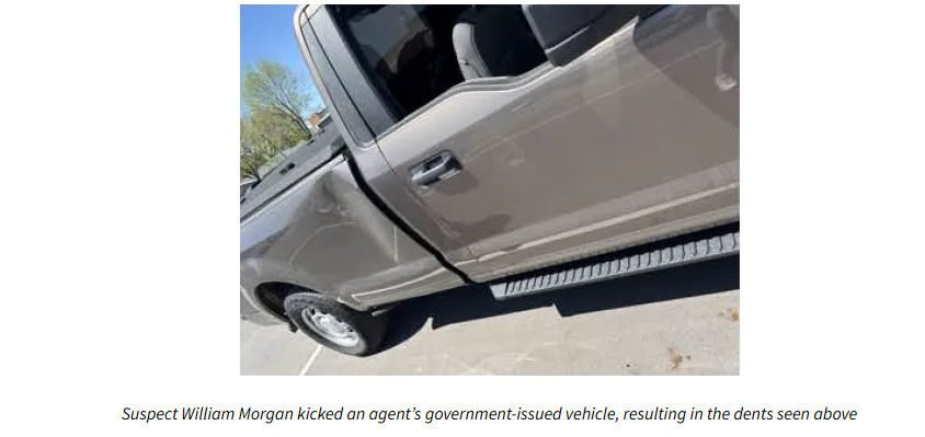 Dents on government vehicle from Morgan kicking it