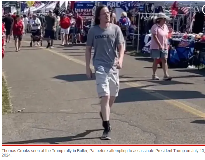 Thomas Matthew Crooks walking at Butler County Fairgrounds wearing Demolition Ranch shirt before shooting