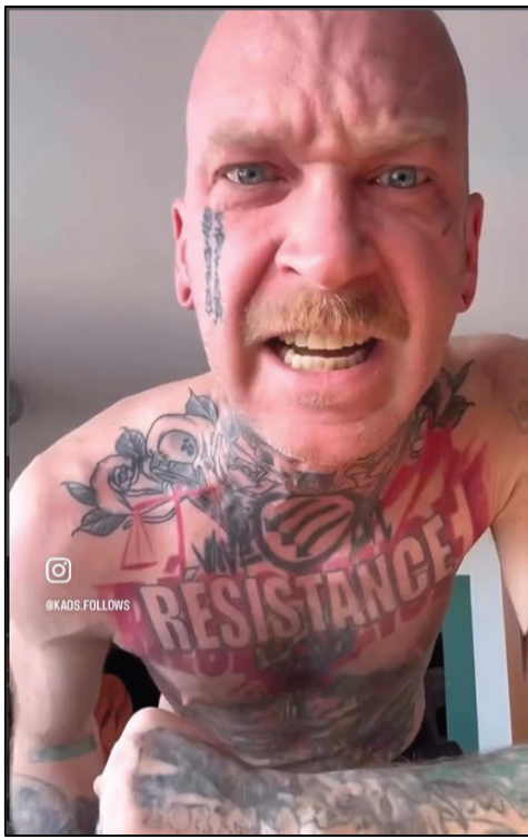 Kyle Wagner shirtless with RESISTANCE chest tattoo