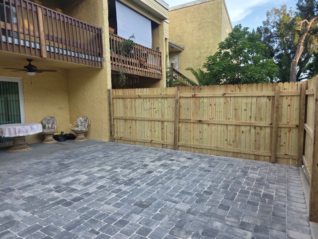 Grey Paver Patio & Wood Fence — Venice, FL