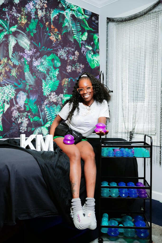 Kanique Miree in her studio with cupping therapy tools