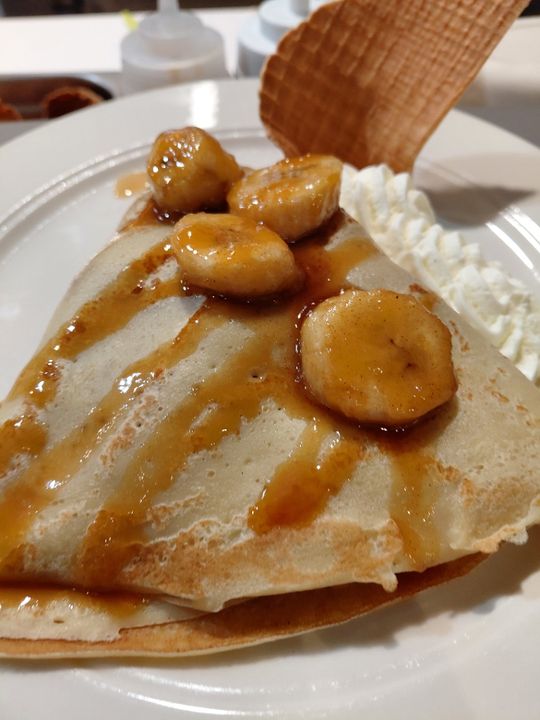 Bananas foster crepe with caramelized bananas and warm caramel sauce at Crepes & Treats