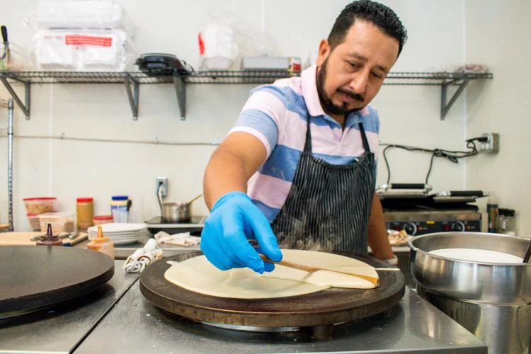 Saul Juarez, owner of Crepes & Treats, making a fresh crepe