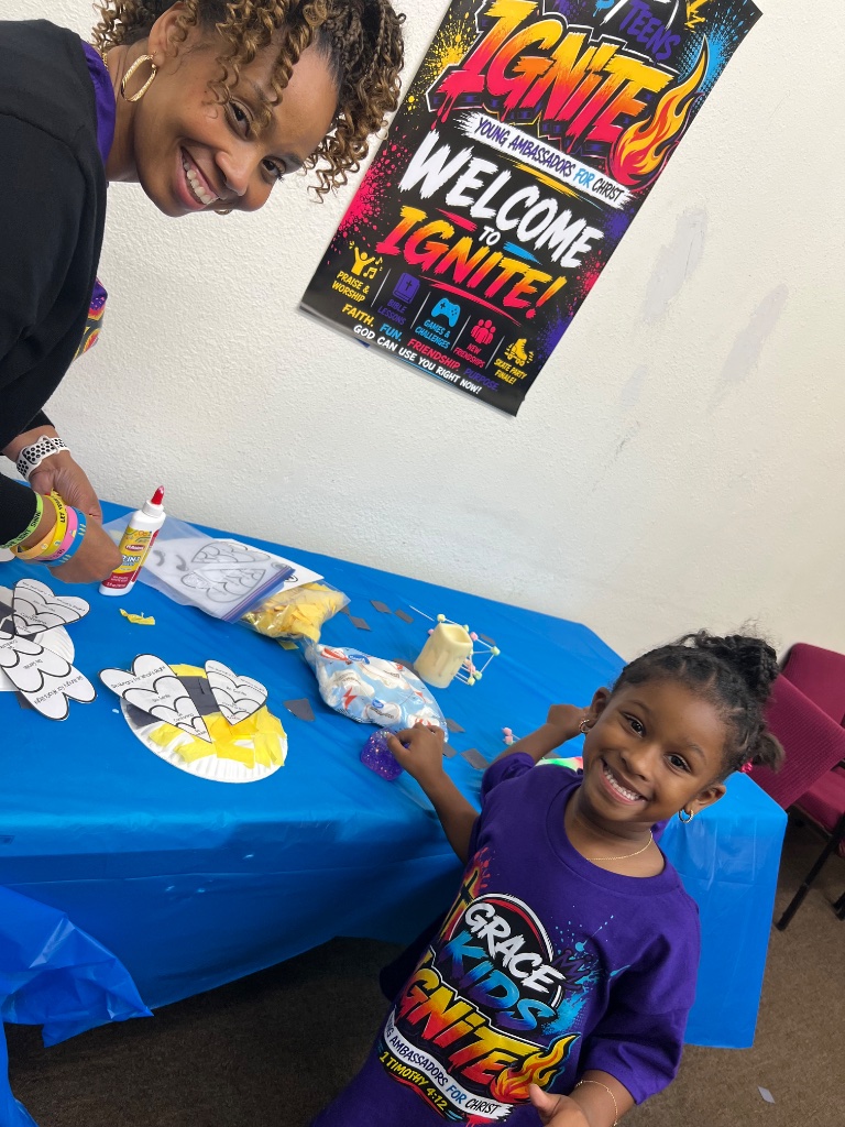 Smiling girl at IGNITE VBS craft table