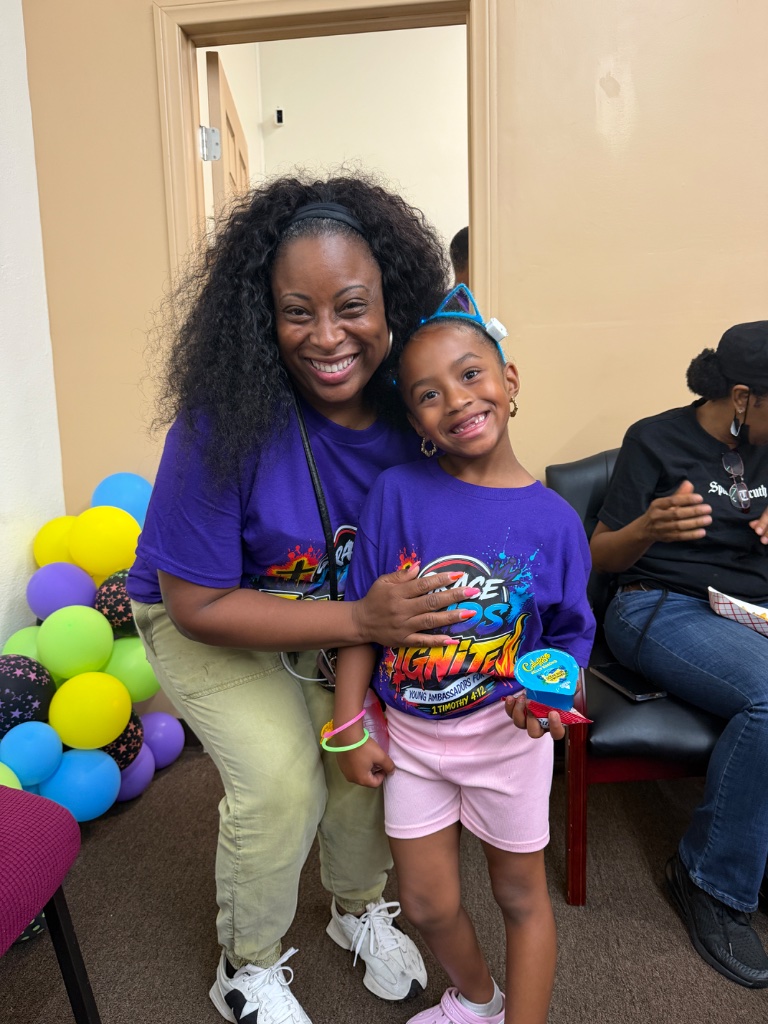 Leader and child posing together at IGNITE VBS