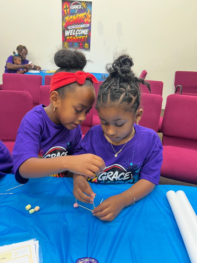 Two girls working on craft together at IGNITE VBS
