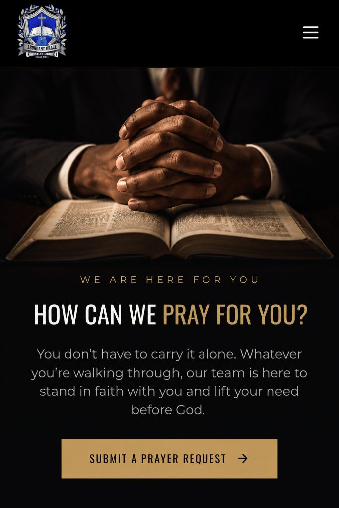 Hands clasped in prayer over an open Bible