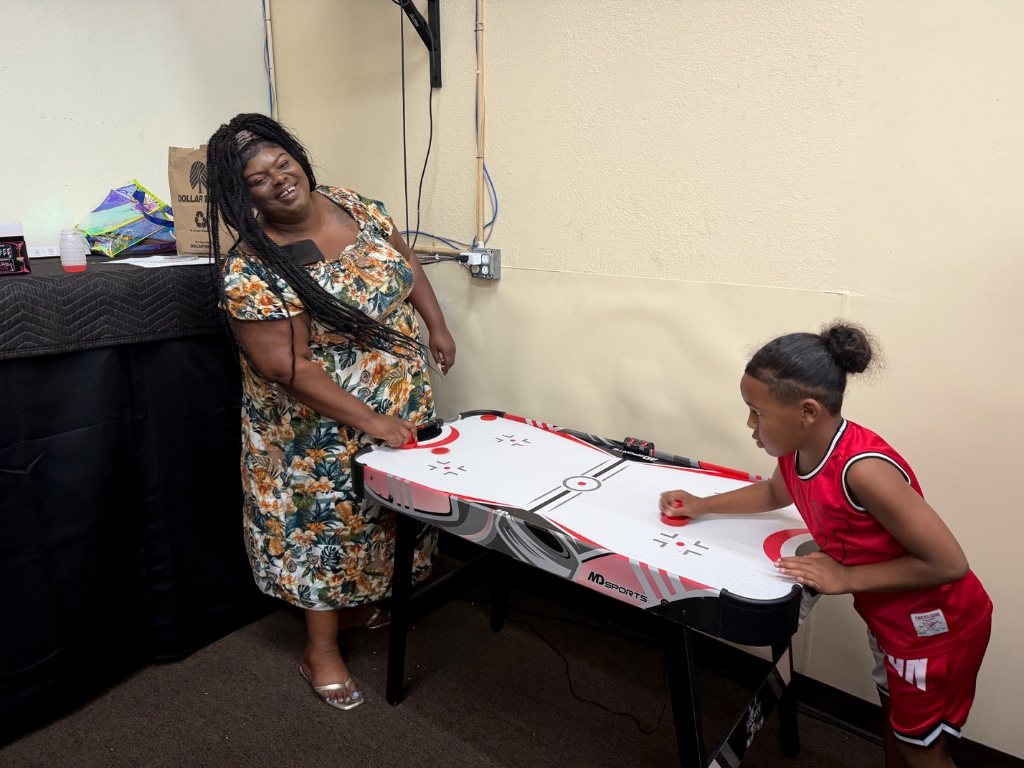 Kids playing air hockey at IGNITE VBS
