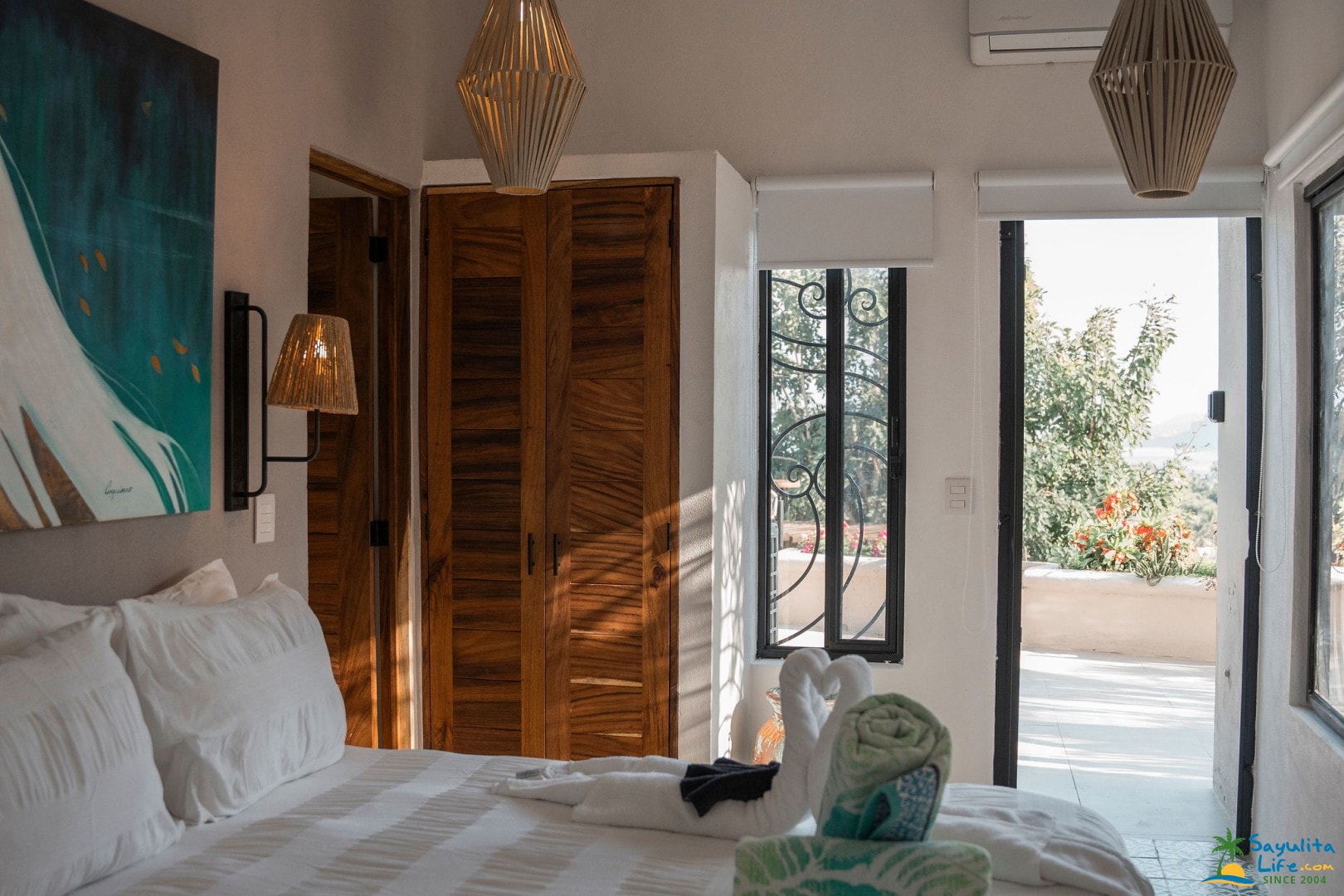 Bedroom with wood wardrobe and terrace access